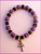 PULSERA CRUZ DE CARAVACA ELASTICA CON CORONITAS DORADAS MORADO Y NEGRO