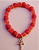 PULSERA CRUZ DE CARAVACA ELASTICA CON CORONITAS DORADAS NARANJA